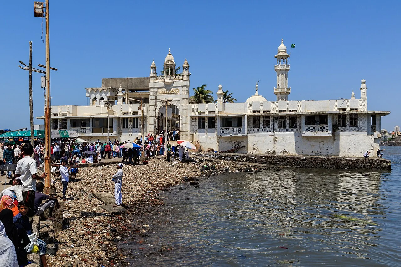 Haji Ali Dargah beside the sea, with devotees on its causeway in Mumbai