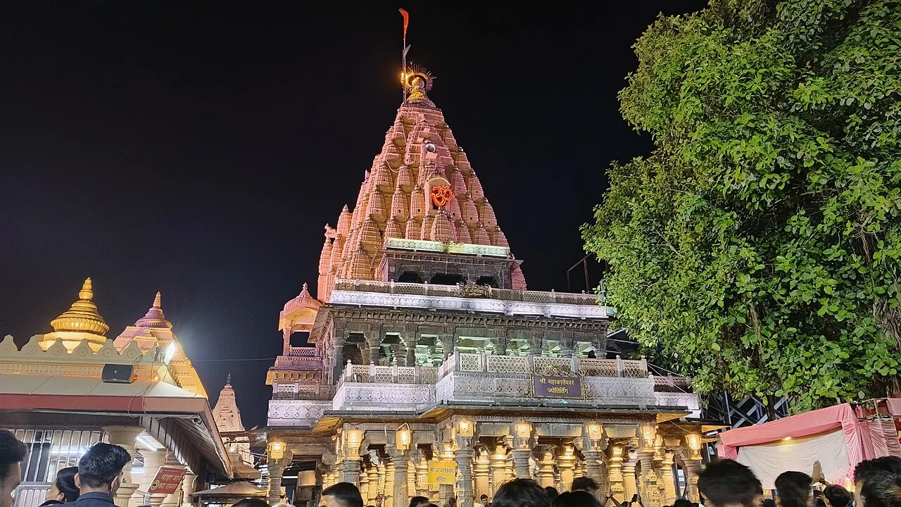 The illuminated spire and entrance of Mahakaleshwar Temple in Ujjain at night