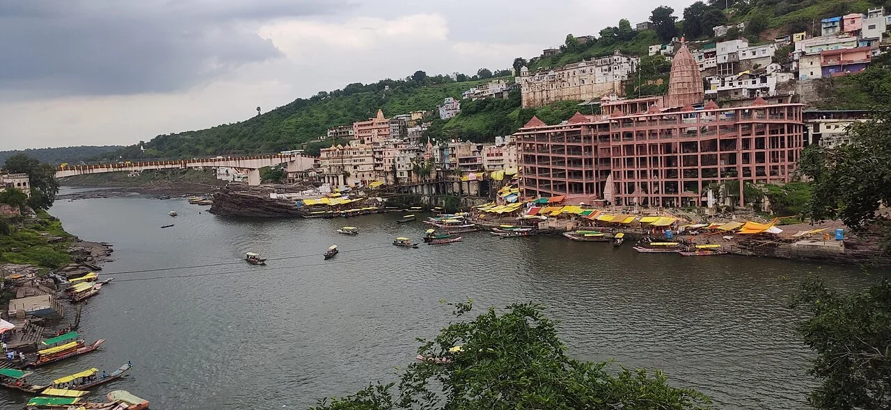 The riverside temple complex and ghats at Omkareshwar, viewed across the Narmada