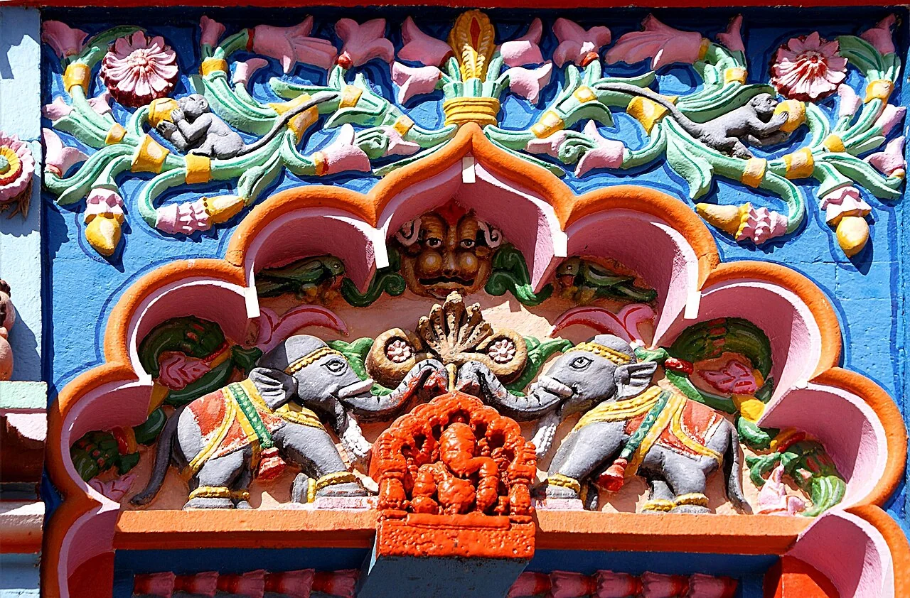 Colourful Ganesha carvings above the entrance of Vighneshwar Temple in Ozar