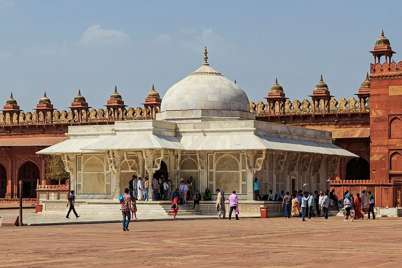 The white marble tomb of Salim Chishti in the sandstone courtyard at Fatehpur Sikri